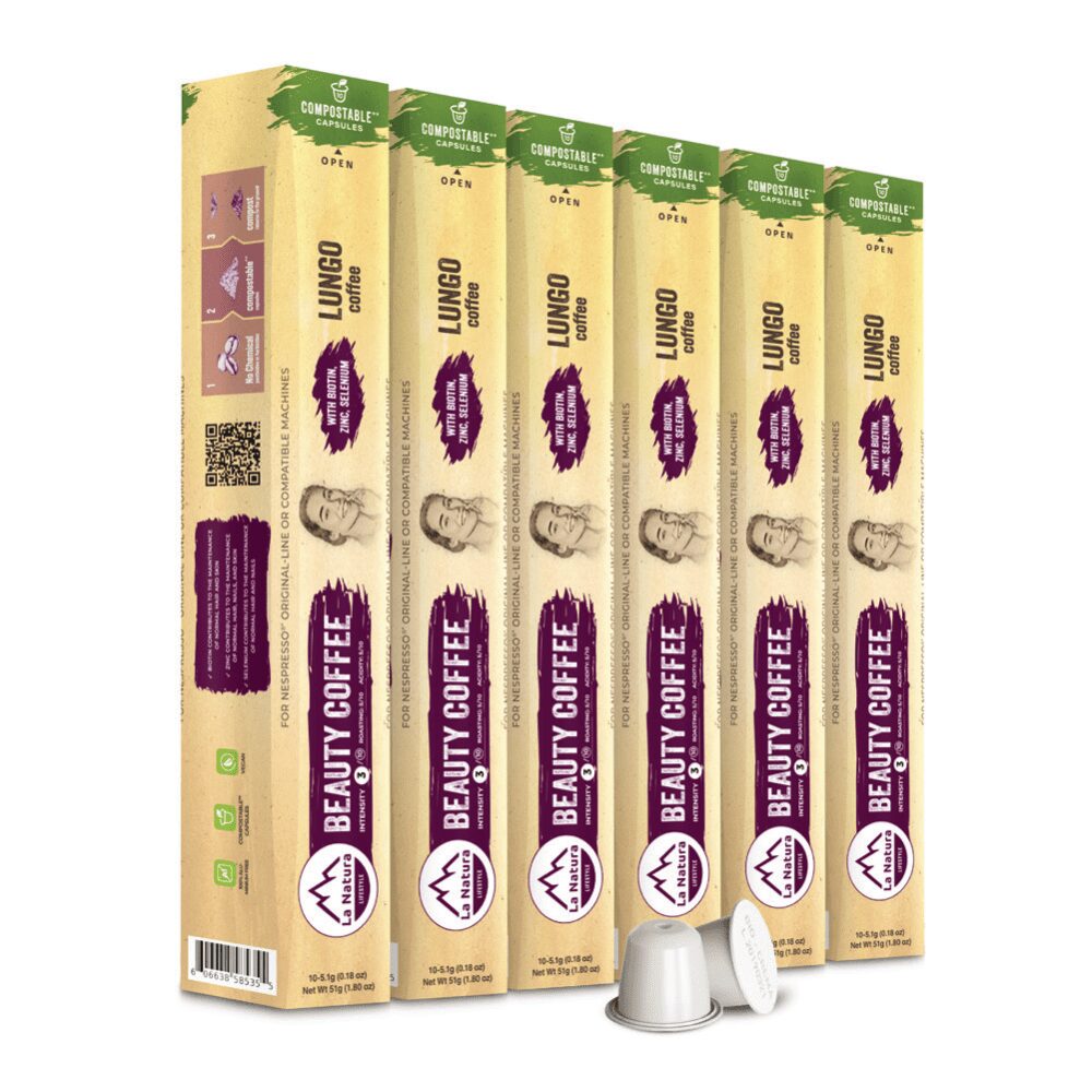 An image showcasing six boxes of Beauty Coffee disposable pods. The vertically aligned boxes feature green, yellow, and purple labels. Each box is marked "Lungo" and prominently displays "100% compostable" and "Organic" badges. A single coffee pod is placed in front.