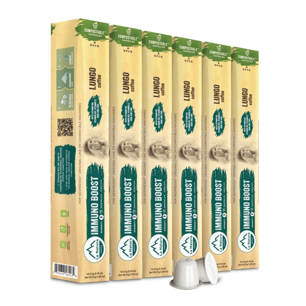 A row of six green and beige cardboard boxes labeled "Immuno Boost Coffee" and "Lungo," standing upright. Each box contains coffee capsules. The boxes feature icons and descriptions, with two capsules shown in front of them. The packaging has a rustic design.